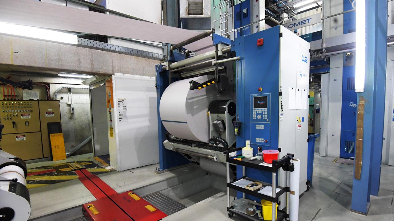 A reel is seen inside the printing room at the NT News during the printing process. Pictures: KERI MEGELUS