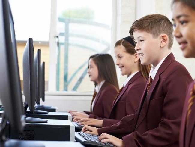 QST - Schools of excellence feature - generic school pic - pupils enjoying computer class