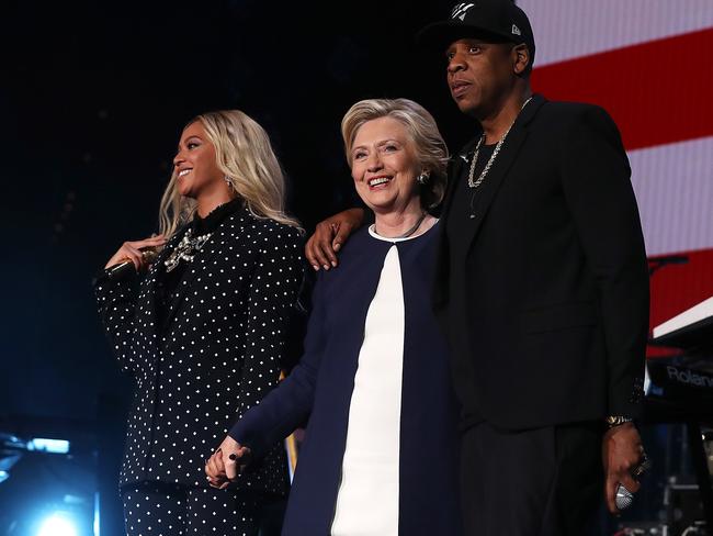 Ms Clinton, pictured with rapper Jay-Z and his wife Beyonce during a rally in Ohio. Picture: Justin Sullivan/Getty Images