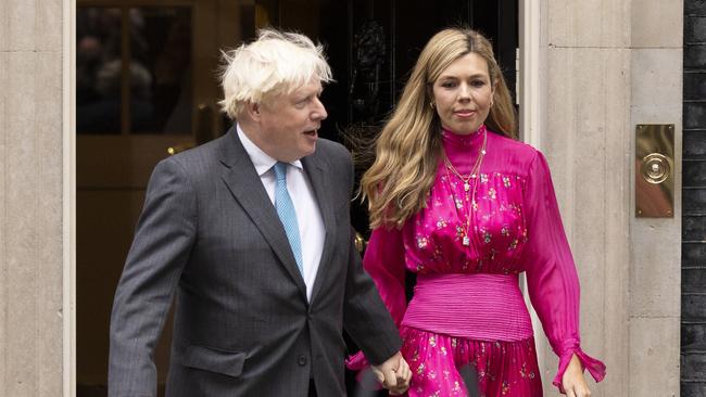 Then prime minister Boris Johnson arrives with his wife Carrie Johnson as he prepares to deliver a farewell address before his official resignation at Downing Street in September. Picture: Getty Images