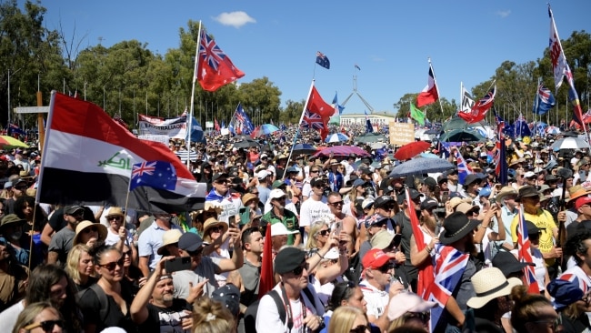 Protesters gather on the lawn of Parliament House on Saturday in Canberra. Picture: Tracey Nearmy/Getty Images