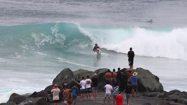 Surfers at Snapper Rocks and Kirra riding the Large swell produced by Cyclone OMA. Photograph : Jason O'Brien