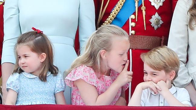 Princess Charlotte, Savannah Phillips and Prince George stand on the balcony of Buckingham Palace in 2018. Picture: AFP/Daniel Leal-Olivas