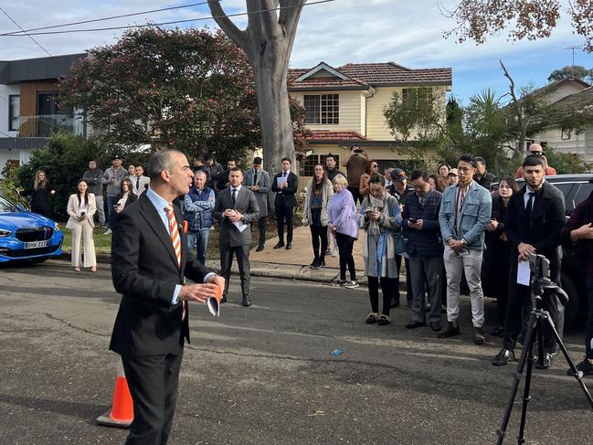 Auctioneer Michael Garofolo calls bids on a Ryde renovator on June 8, 2024. Picture: supplied/ NSW real estate.