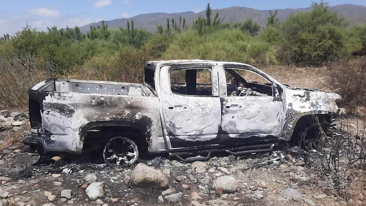 Mexican media claim this burnt-out vehicle belonging to the missing trio were found several kilometres from the search site.