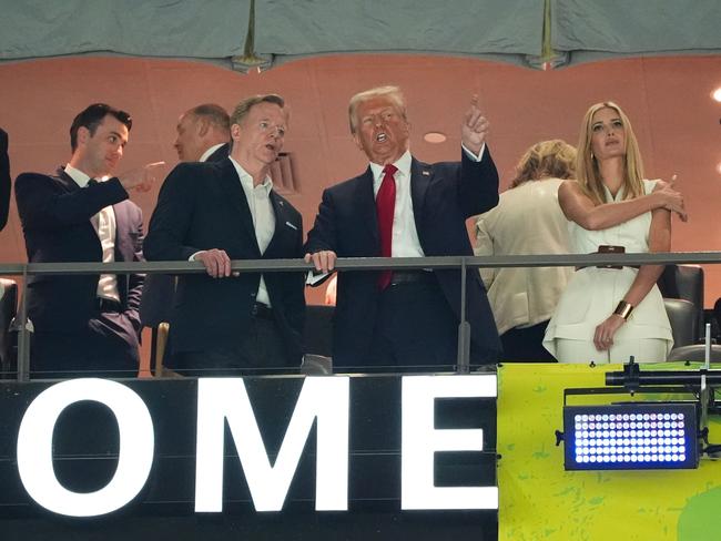 NFL Commissioner Roger Goodell speaks with US President Donald Trump at Super Bowl LIX not long after Trump announced 25 per cent tariffs on steel. Picture: TIMOTHY A. CLARY / AFP)