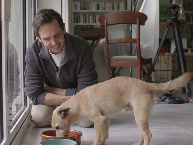 Milo the dog with owner Jason Whatnall in UK, a month after escaping in Tullamrine.