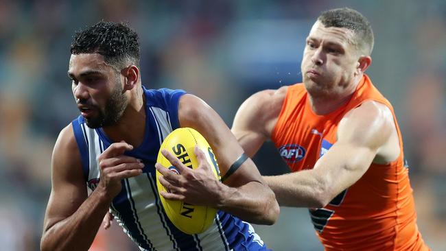 HOBART, AUSTRALIA - JUNE 13: Tarryn Thomas of the Kangaroos marks infront of Sam J. Reid of the Giants during the round 13 AFL match between the North Melbourne Kangaroos and the Greater Western Sydney Giants at Blundstone Arena on June 13, 2021 in Hobart, Australia. (Photo by Mark Metcalfe/AFL Photos/via Getty Images)