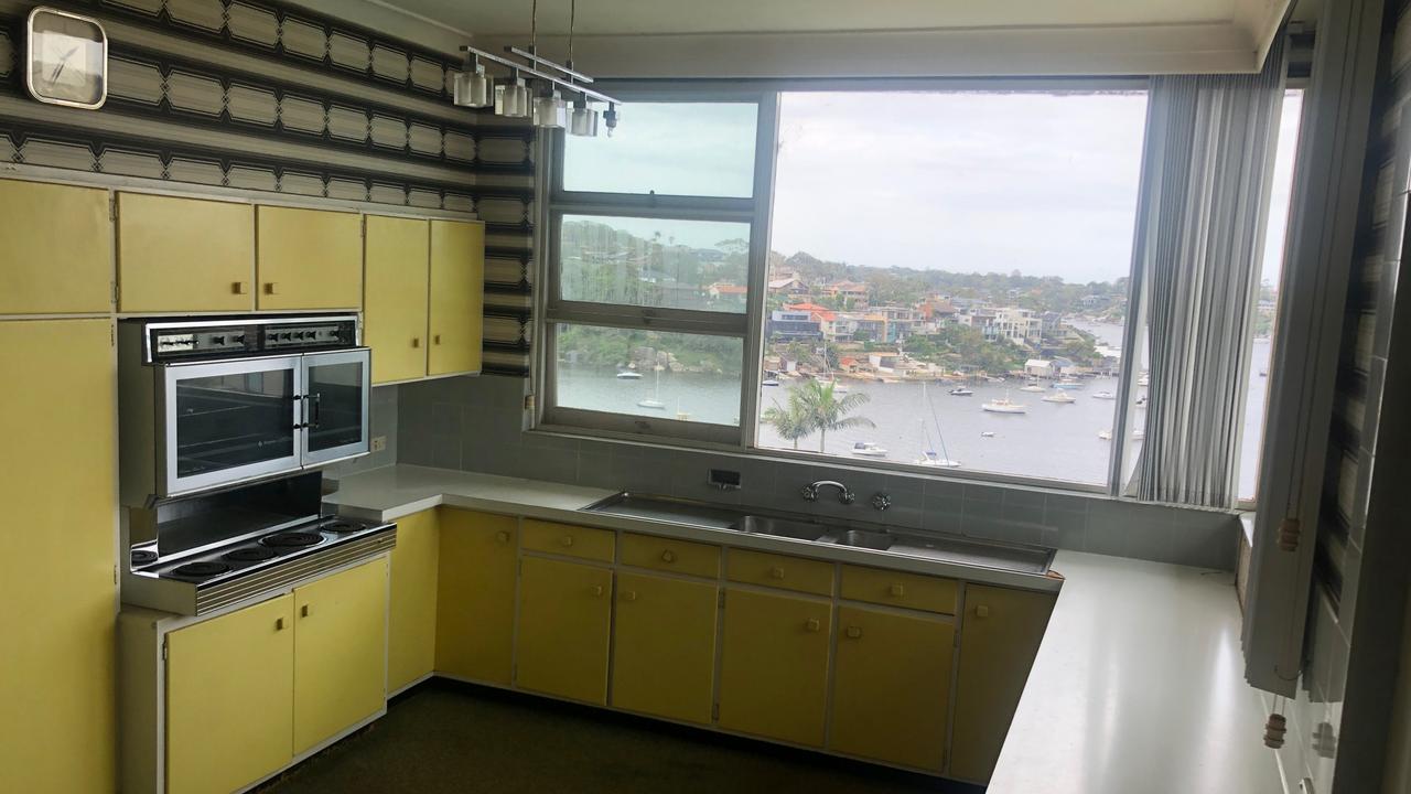 The original yellow kitchen was outdated but came with great views. Picture: upplied