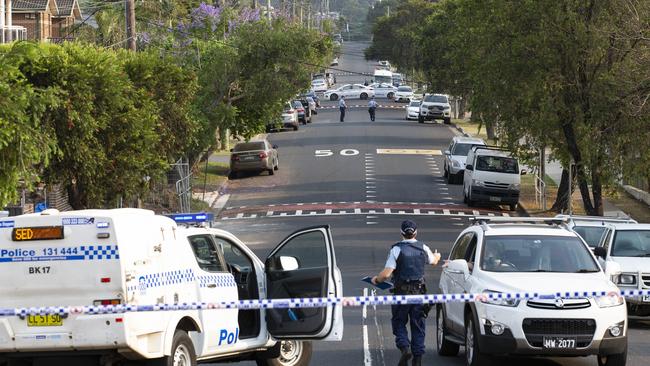 Crime scene … Police seal off William Street, Condell Park, today.