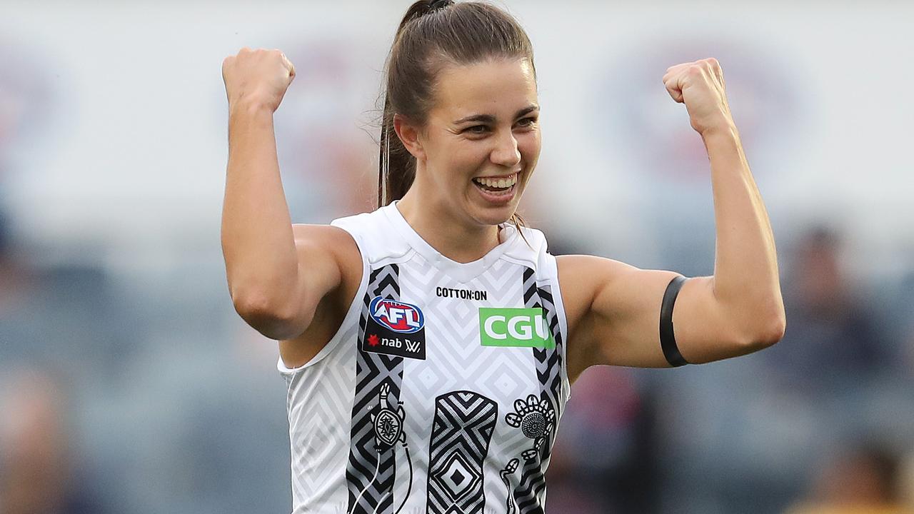 Chloe Molloy is all smiles after a goal that helped the Pies vanquish the Blues. Picture: Michael Klein