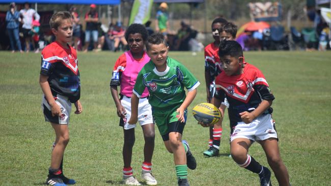 Bowen Seagulls Black's Matiu Mone (right) is chased by Proserpine Whitsundays White's Chevy Faust at the Paul Bowman Challenge for under 9s rugby league players at Proserpine.