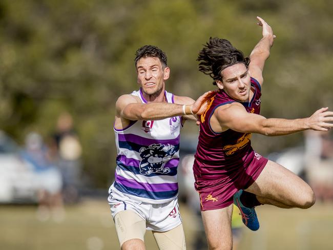 Palm Beach Currumbin's Thomas Thynne is pushed by Broadbeach player Evan Panozza at the QAFL Round 6 Aussie Rules match between Broadbeach and Palm Beach Currumbin at Subaru Oval. Picture: Jerad Williams