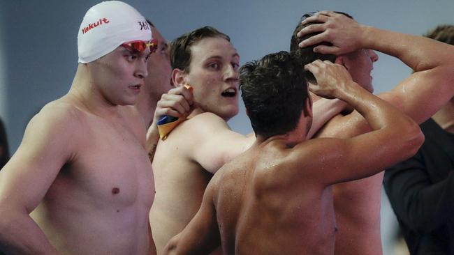 Sun Yang walks past the victorious Aussies.