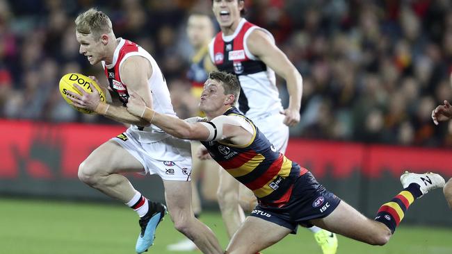 St Kilda’s Nick Hind in run down by Adelaide’s Matt Crouch. Picture SARAH REED