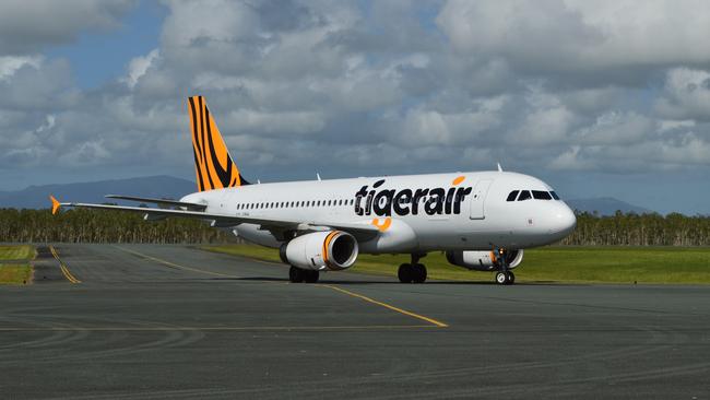 AIRLIE BEACH .. for Briar Jensen story .. Inaugural Tigerair service touches down at Whitsunday Coast Airport 1 April 2014