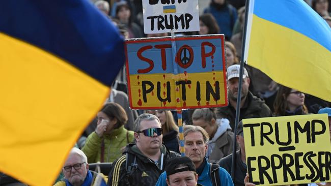 Placards reading 'Dump Trump', 'Stop Putin' and 'Trump (is a) blackmailer' state the case of pro-Ukraine protesters in Berlin on March 9. Picture: AFP