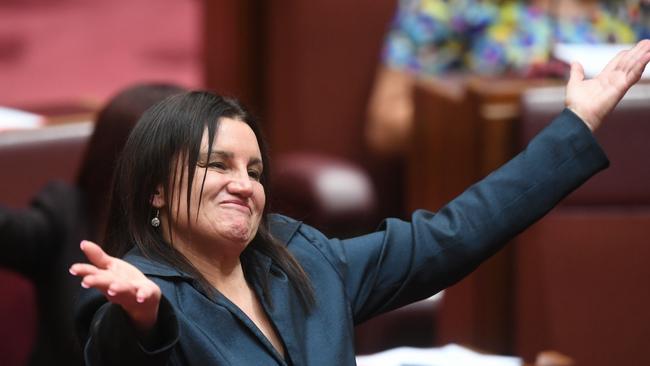 Tasmanian Senator Jacqui Lambie reacts after delivering a statement on her resignation in the Senate chamber at Parliament House in Canberra, Tuesday, November 14, 2017. (AAP Image/Lukas Coch) NO ARCHIVING