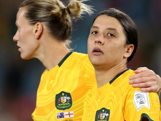 SYDNEY, AUSTRALIA - AUGUST 16: Sam Kerr of Australia is consoled by Emily Van-Egmond after the team's 1-3 defeat and elimination from the tournament following the FIFA Women's World Cup Australia & New Zealand 2023 Semi Final match between Australia and England at Stadium Australia on August 16, 2023 in Sydney / Gadigal, Australia. (Photo by Brendon Thorne/Getty Images)