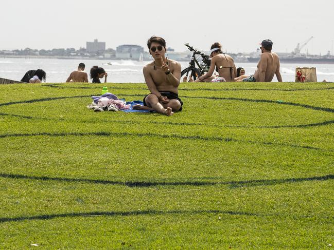 Circles for social isolation in St Kilda as restrictions loosen. Picture: Getty Images