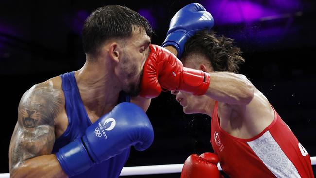 Harry Garside lands a punch but not enough. Picture: Michael Klein