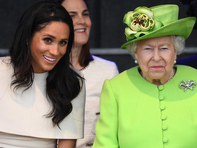 WIDNES, ENGLAND - JUNE 14:  Queen Elizabeth II sits with Meghan, Duchess of Sussex during a ceremony to open the new Mersey Gateway Bridge on June 14, 2018 in the town of Widnes in Halton, Cheshire, England. Meghan Markle married Prince Harry last month to become The Duchess of Sussex and this is her first engagement with the Queen. During the visit the pair will open a road bridge in Widnes and visit The Storyhouse and Town Hall in Chester.  (Photo by Jeff J Mitchell/Getty Images)