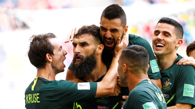 Soccer Football - World Cup - Group C - Denmark vs Australia - Samara Arena, Samara, Russia - June 21, 2018   Australia's Mile Jedinak celebrates scoring their first goal with team mates          REUTERS/Michael Dalder - RC1A947534B0