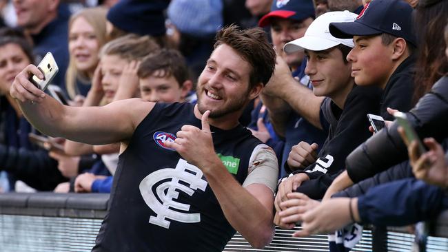 Dale Thomas celebrates with the fans after the win. Picture: George Salpigtidis