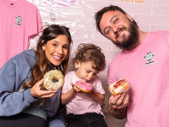 Josh Rivers, partner Chimere and their son Lando at their Landough's doughnut shop on Jetty Rd, Glenelg. Picture: Facebook
