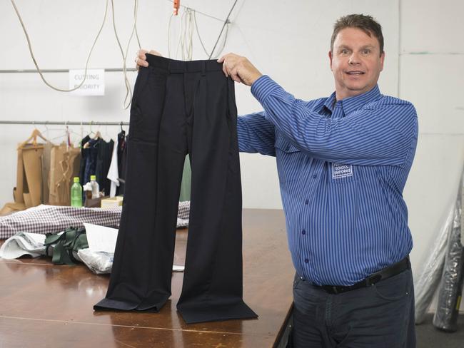 Tony Apps, owner of Yeronga School Uniforms, says his sizing hasn’t changed however larger garments are being made. Picture: News Corp Australia