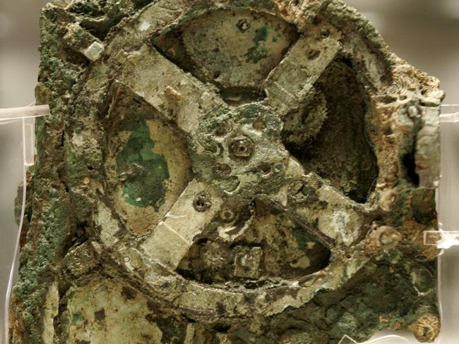 A fragment of the 2100-year-old Antikythera Mechanism. Believed to be the earliest surviving mechanical computing device, it is a bronze system of cogs and wheels. Picture: Thanassis Stavrakis/AP