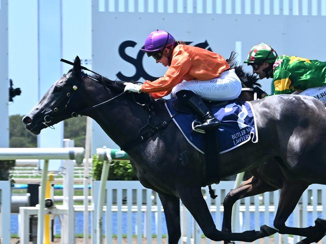 El Morzillo storms over the top of her rivals to win the QTIS 2YO Handicap for jockey Cejay Graham. Picture: Grant Peters - Trackside Photography