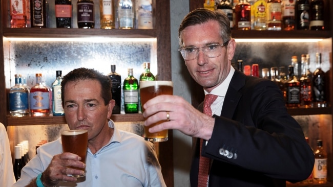 NSW Premier Dominic Perrottet celebrating freedom day on October 11 while having a beer with the NSW Deputy Premier. Picture: Getty.