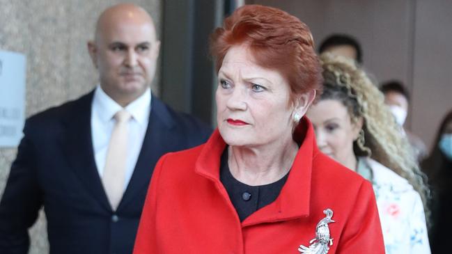 One Nation leader Pauline Hanson walks out of the Supreme Court in Sydney with lawyer Danny Eid and witness Terri-lea Vairy. Picture: John Grainger