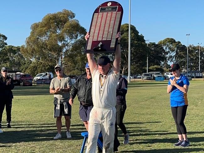 Aaron Shackleford lifts the Jika Shield.