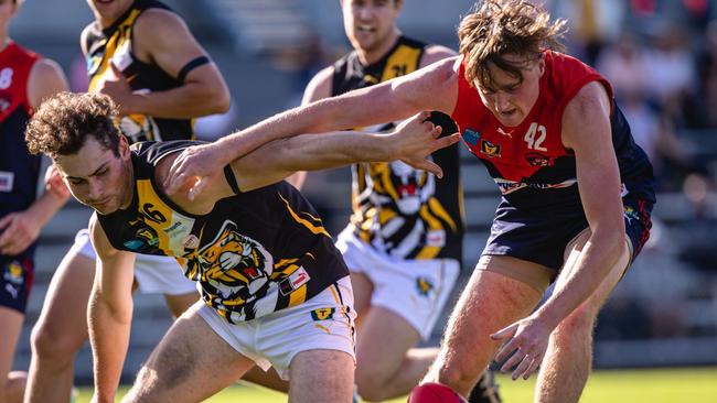 Micah Reynolds (left) battles with North Hobart's Austin Keeling during the round 8 TSL clash between Tigers and North Hobart. PICTURE: Linda Higginson