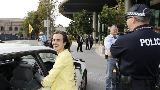 Eric Herbert from Extinction Rebellion pictured outside 1 William St, Brisbane. Picture: Josh Woning/AAP