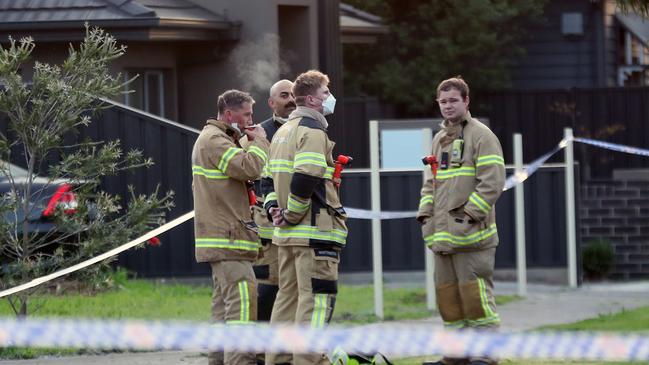 Firefighters at the scene of the fatal blaze in Baird St. Picture: David Crosling