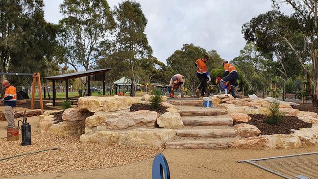 Workers constructing the new nature playground at Wilfred Taylor Reserve. Picture: Onkaparinga Council