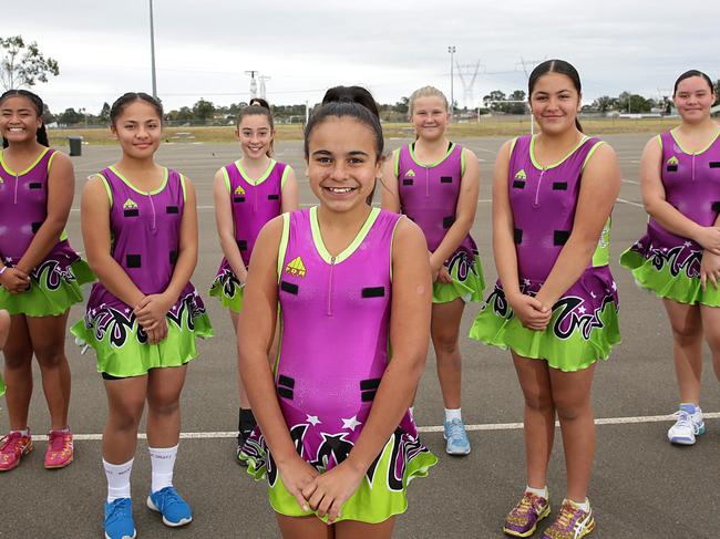 Front team captain... Kaliayh Marlowe 12-years with her team mates, Mount Druitt U/13 representative team at Dot Cameron Netball Court6s in Blackett, NSW, Australia. 2 June, 2018. Mount DruittÕs under 13s are training to compete at the three-day 2018 NSW State Age Netball Championships.(AAP IMAGE / Carmela Roche).