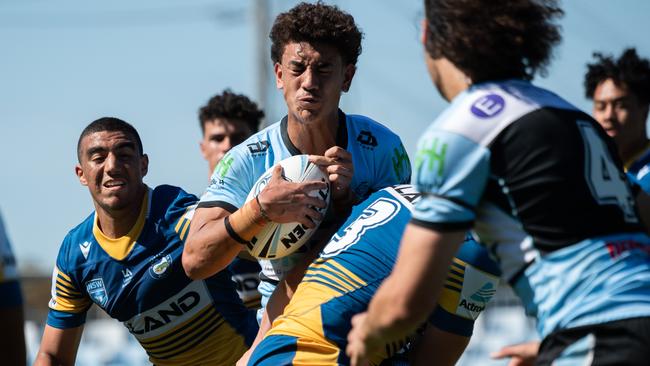 Cronulla’s Ryan Clements clashes into the Eels. Picture: Monique Harmer