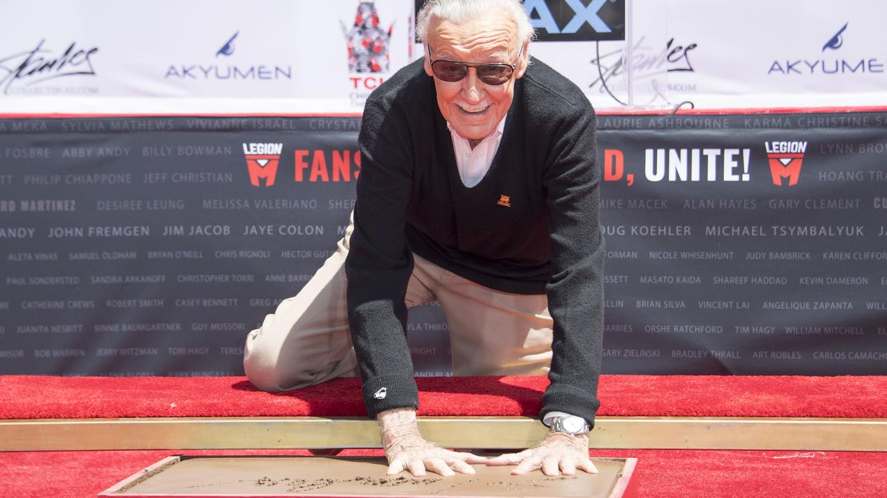 Stan Lee places his hands in cement during his hand and footprint ceremony in Hollywood, California. Picture: AFP