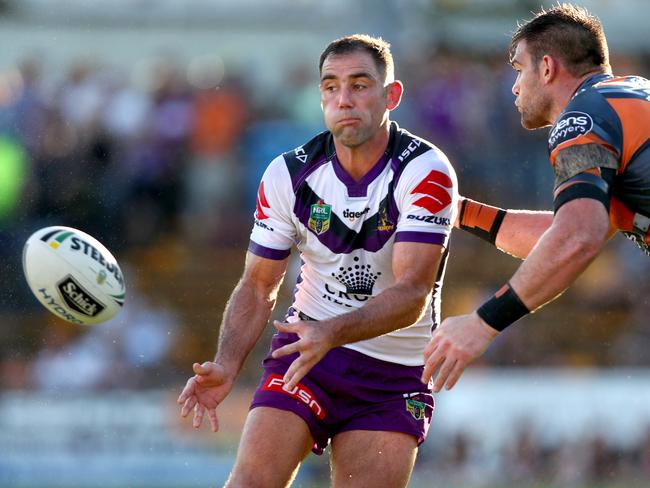 Storm skipper Cameron Smith gets a pass away during the win over the Wests Tigers at Leichhardt Oval. Picture: Gregg Porteous