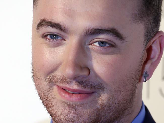 (FILES) This February 24, 2015 file photo shows British singer-songerwriter Sam Smith on the red carpet at the ELLE Style Awards 2015 in London. Smith appeared to be in good spirits on May 14, 2015, after vocal surgery that will leave the rising star silent for weeks. The British soul sensation, who enjoyed a meteoric rise thanks to his hit "Stay With Me," underwent surgery at a New York clinic after doctors detected a hemorrhage in his vocal cords. AFP PHOTO / JUSTIN TALLIS