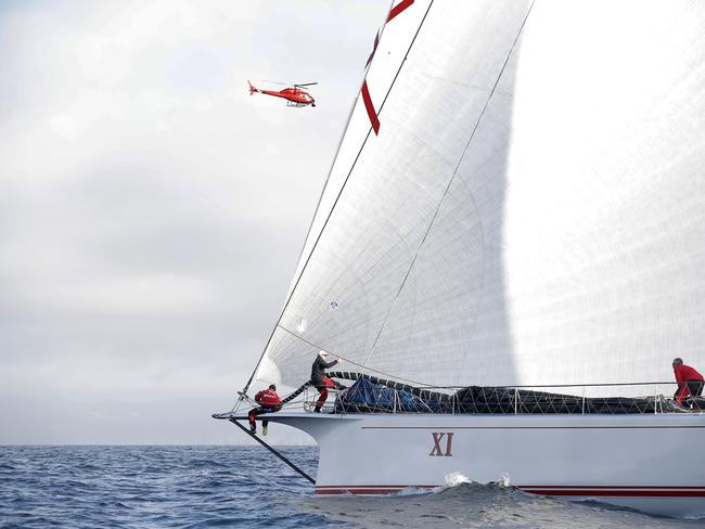 Wild Oats XI skippered by Mark Richards sails up the River Derwent on her way to a 9th line honours victory in the 2018 Sydney to Hobart Yacht Race. The yacht crossed the line in 1d 19hrs 7mins 21secs . Picture: RICHARD JUPE