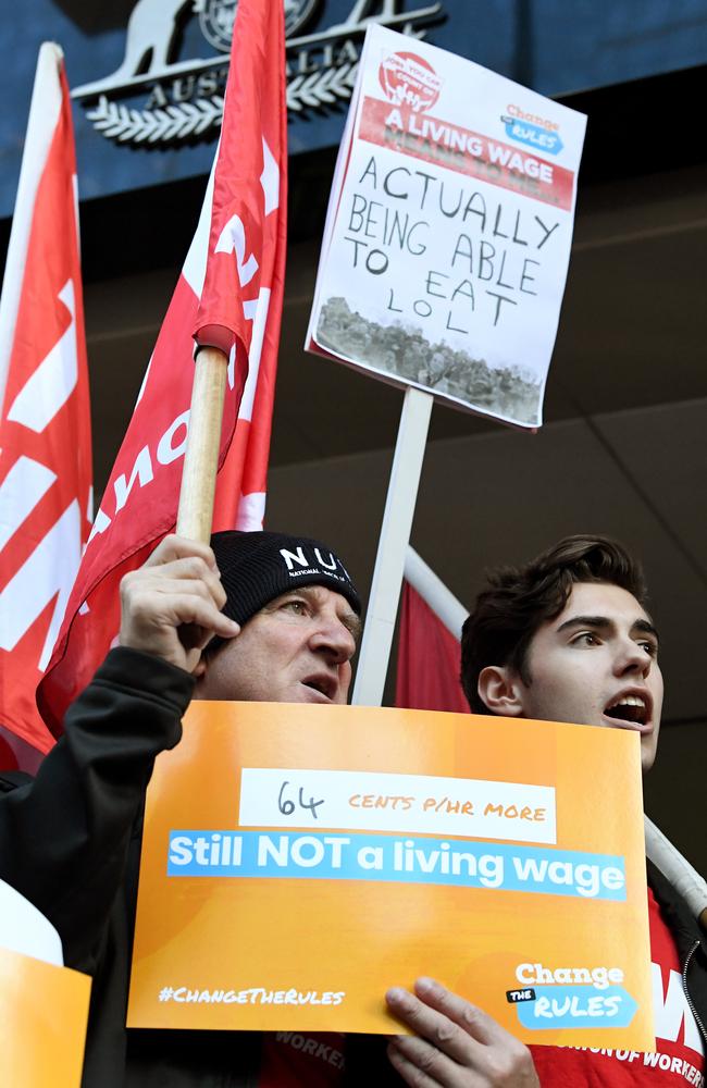 ACTU members rally outside the offices of the Fair Work Commission, saying workers are still living in poverty. Picture: AAP Image/Joe Castro