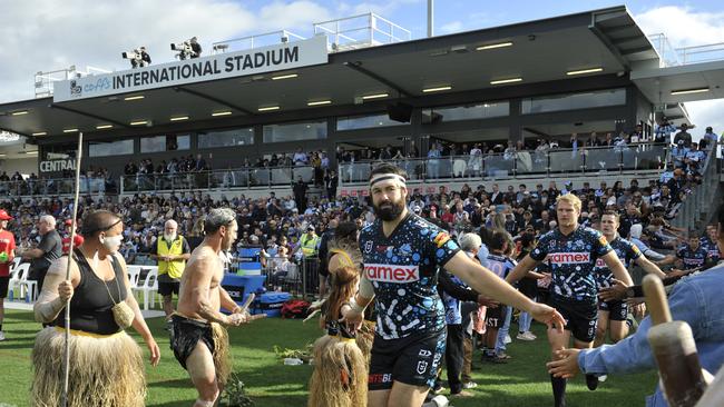 Aaron Woods runs out onto the C.ex Stadium pitch in front of a sellout crowd. Photo: Tim Jarrett