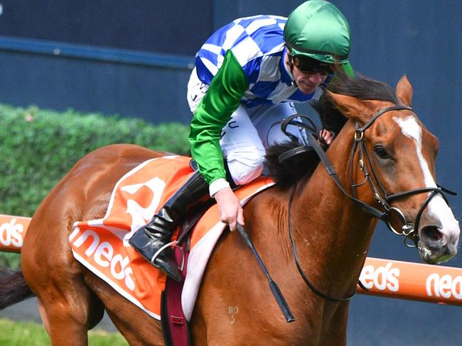 Jockey John Allen rides Grand Promenade to victory in race 2, the Lamaro's Hotel Grand Handicap Classic, during the 2020 All-Star Mile at Caulfield Racecourse in Melbourne, Saturday, March 14, 2020. (AAP Image/Vince Caligiuri) NO ARCHIVING, EDITORIAL USE ONLY