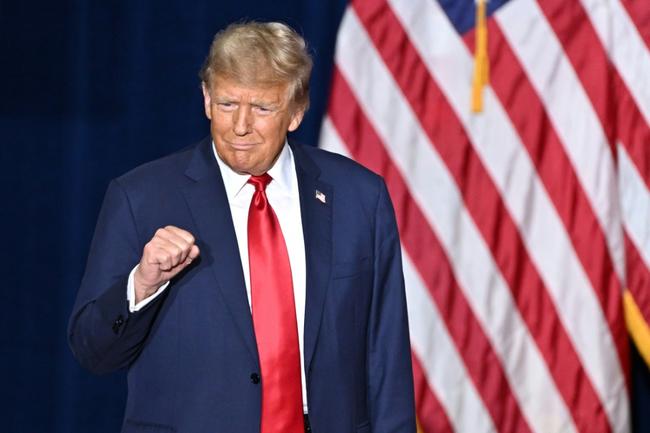 Former US president and Republican presidential hopeful Donald Trump arrives at a watch party during the 2024 Iowa Republican presidential caucuses in Des Moines, Iowa, on January 15, 2024