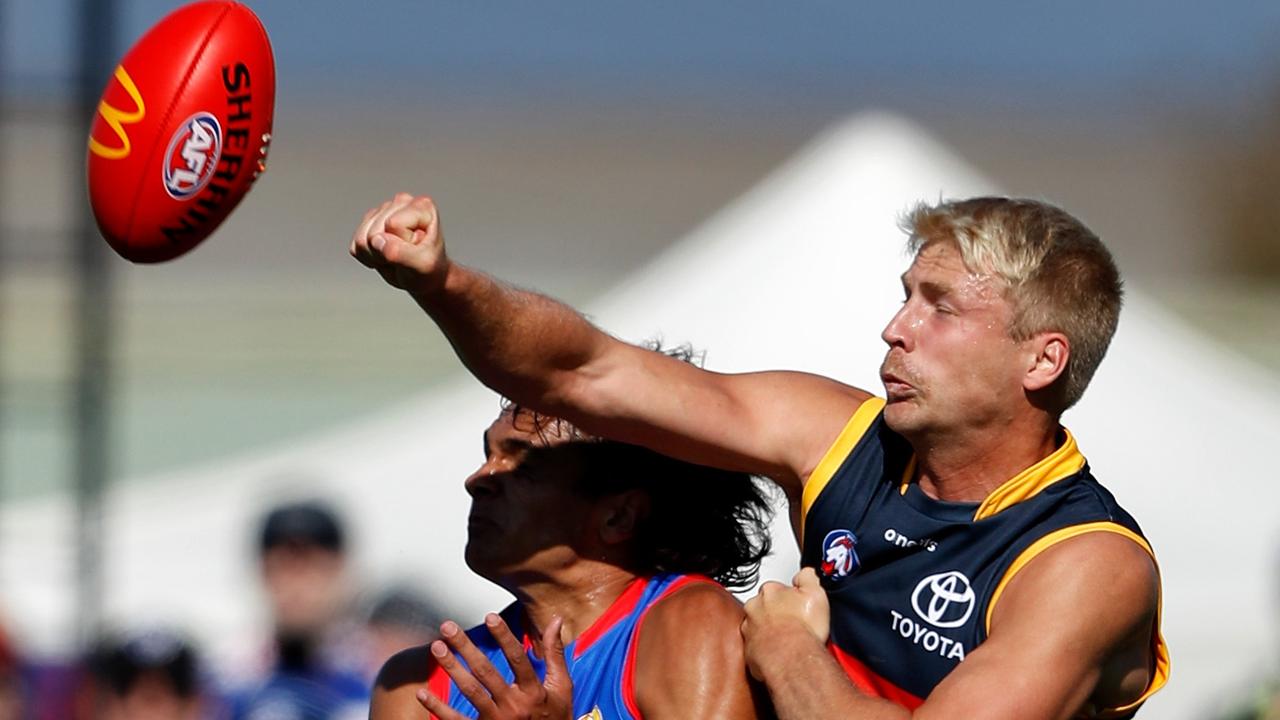 Billy Frampton punches the ball away during a contest against the Western Bulldogs in Ballarat earlier this year. Picture: Dylan Burns/Getty Images